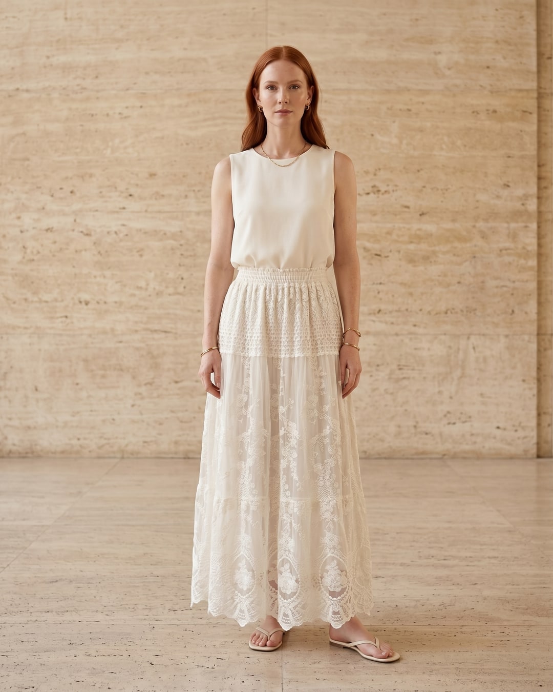 Aemilia floral-embroidered lace A-line chiffon maxi dress in Avorio — full front, on a model in a warm Roman travertine studio for Hugo Caesar Tassi