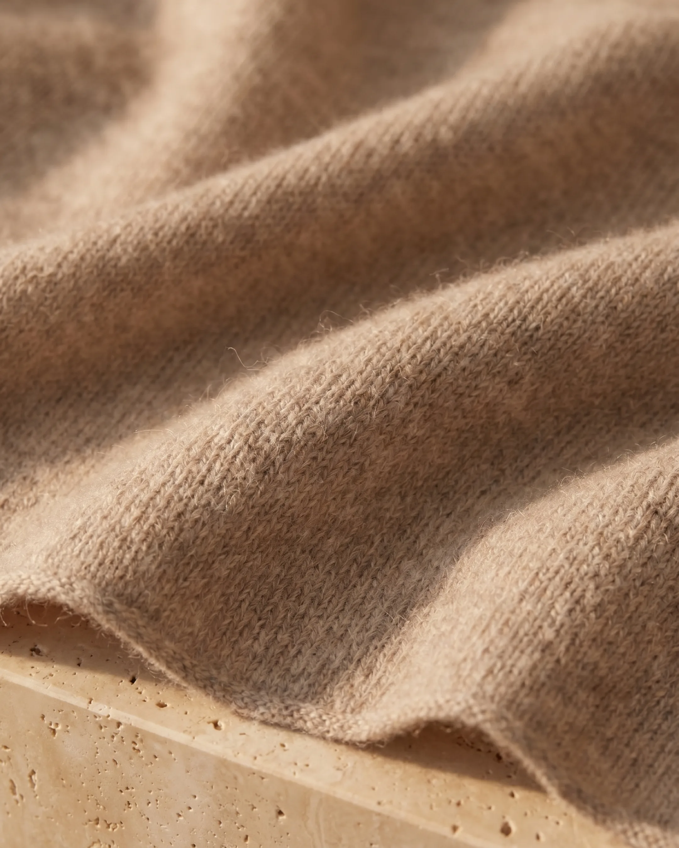 Hugo Caesar Tassi Aquileia stole fabric close-up showing the fine heathered cashmere knit