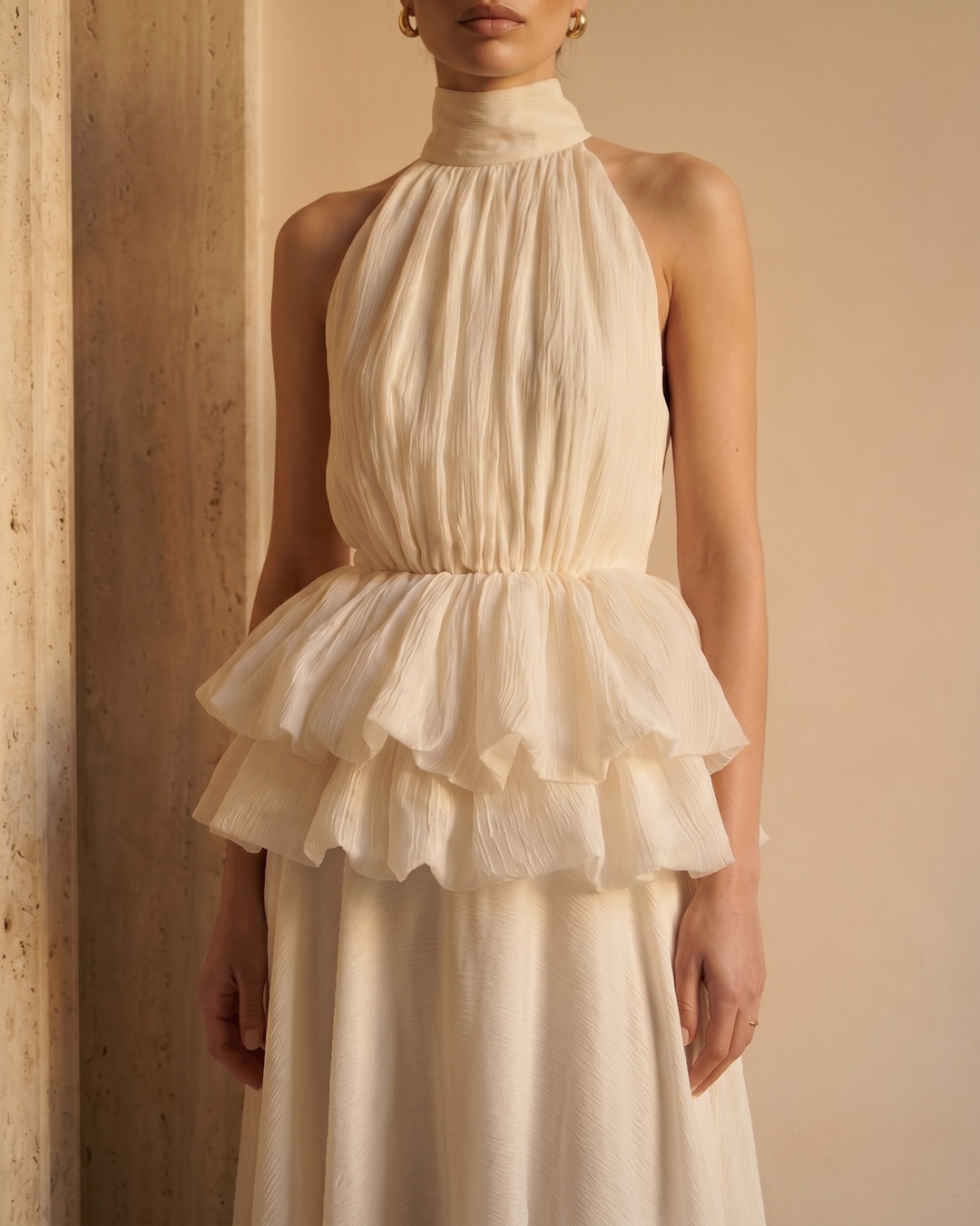 Hugo Caesar Tassi Fulvia close-up of the soft stand collar, gathered bodice and two-tiered ruffle peplum in ivory crepe