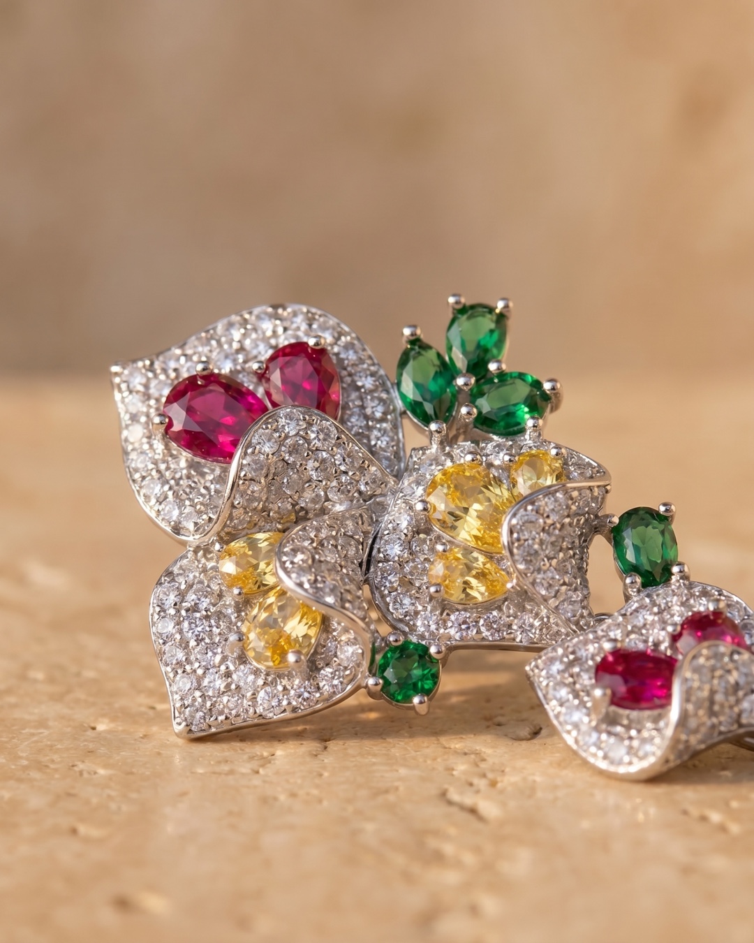 Hugo Caesar Tassi Gemma macro of the silver-set flowering crystal cluster with clear pave and ruby, citrine and emerald cubic zirconia