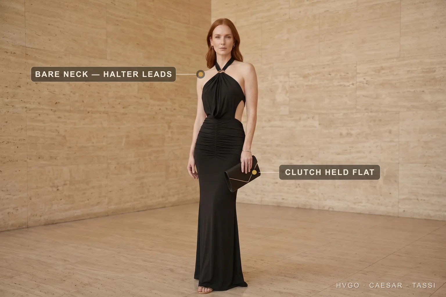 A woman in a Hugo Caesar Tassi black halter evening gown holding a black leather envelope clutch flat in one hand, labelled to show the clutch held flat and the bare halter neck leading, in a Roman travertine studio
