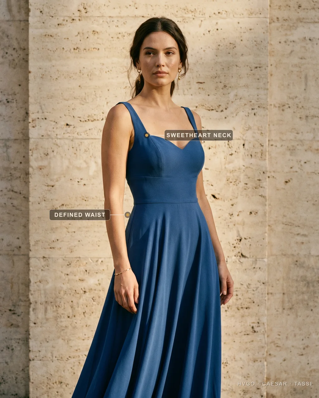 Sweetheart fit-and-flare gown for an hourglass figure — Hugo Caesar Tassi Three-quarter view of a woman with an hourglass figure in a Hugo Caesar Tassi sapphire fit-and-flare gown, labelled to show the sweetheart neckline framing the bust and the defined waist nipping in
