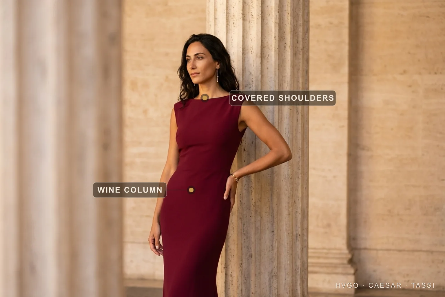 Italian wedding guest in a wine crepe column — Hugo Caesar Tassi Italian wedding guest Chiara in a deep Porpora wine matte-crepe column gown with a boat neckline, leaning in a three-quarter contrapposto against a fluted travertine column in a warm Roman setting, labelled to show the covered shoulders and the wine column silhouette — the elegant, never-white, church-ready answer