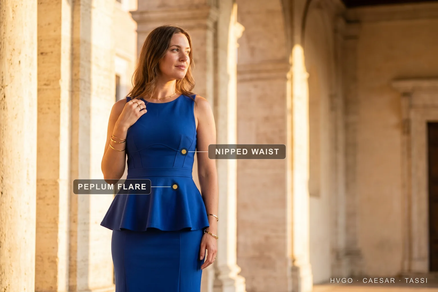 A woman with a rectangle figure in a Hugo Caesar Tassi sapphire fit-and-flare gown in a Roman loggia, labelled to show the defined nipped waist and the flared skirt building curve at the hip