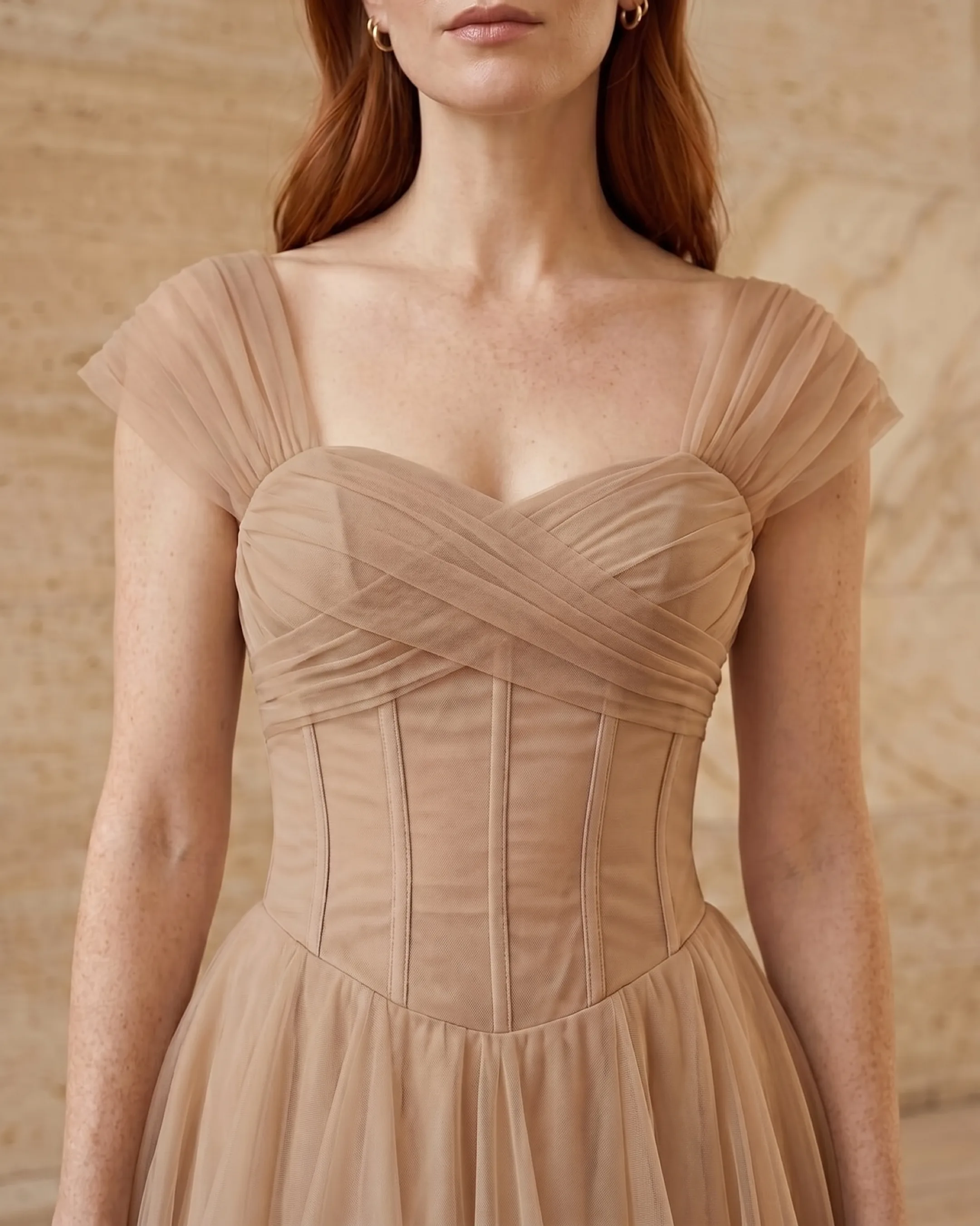 Julia dress in Travertine apricot — soft V-neckline and ruched waist detail in a Roman travertine studio, Hugo Caesar Tassi