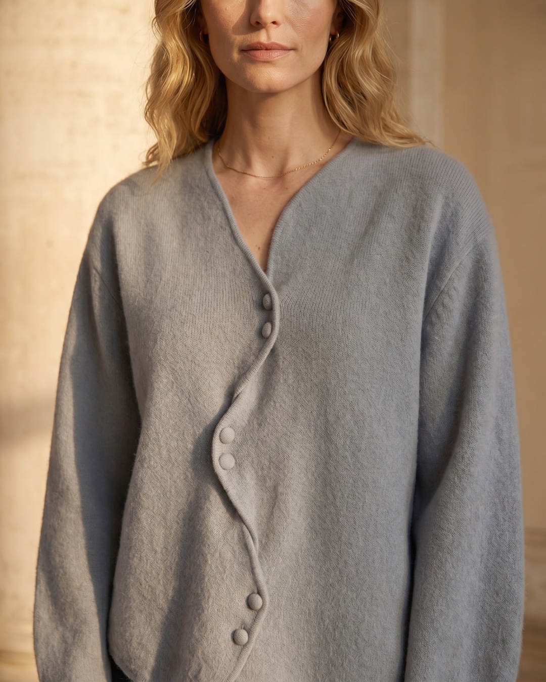 Hugo Caesar Tassi Lucretia asymmetric wavy button placket and V-neckline detail