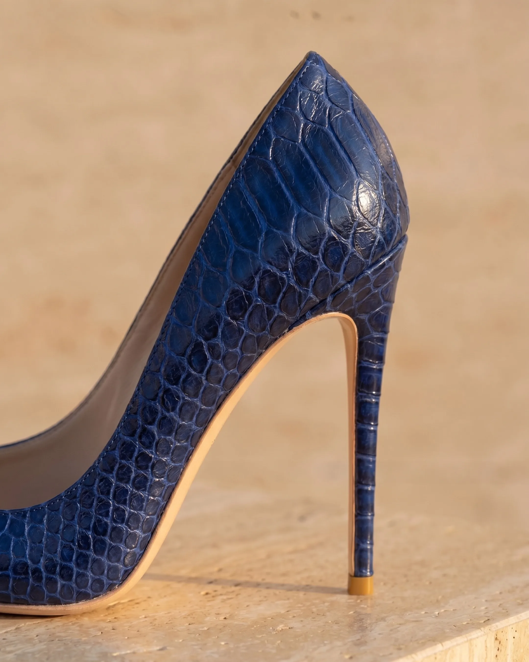 Hugo Caesar Tassi Matidia macro of the tall slim stiletto heel and the cobalt snake-embossed leather grain