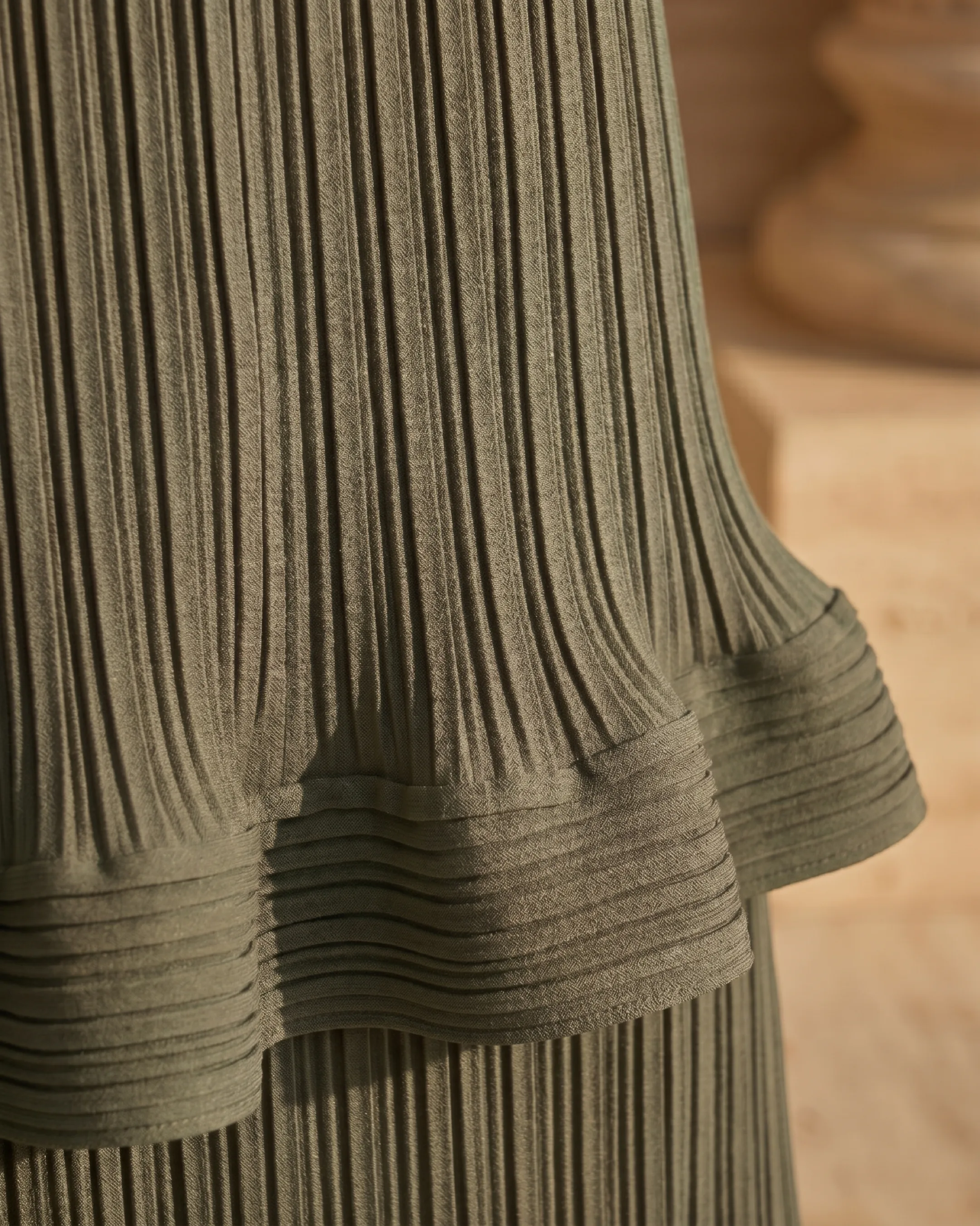 Hugo Caesar Tassi Munatia macro of the fine micro-pleated spandex-blend crepe with a horizontal pleated ruffle flounce in Verde Antico sage green