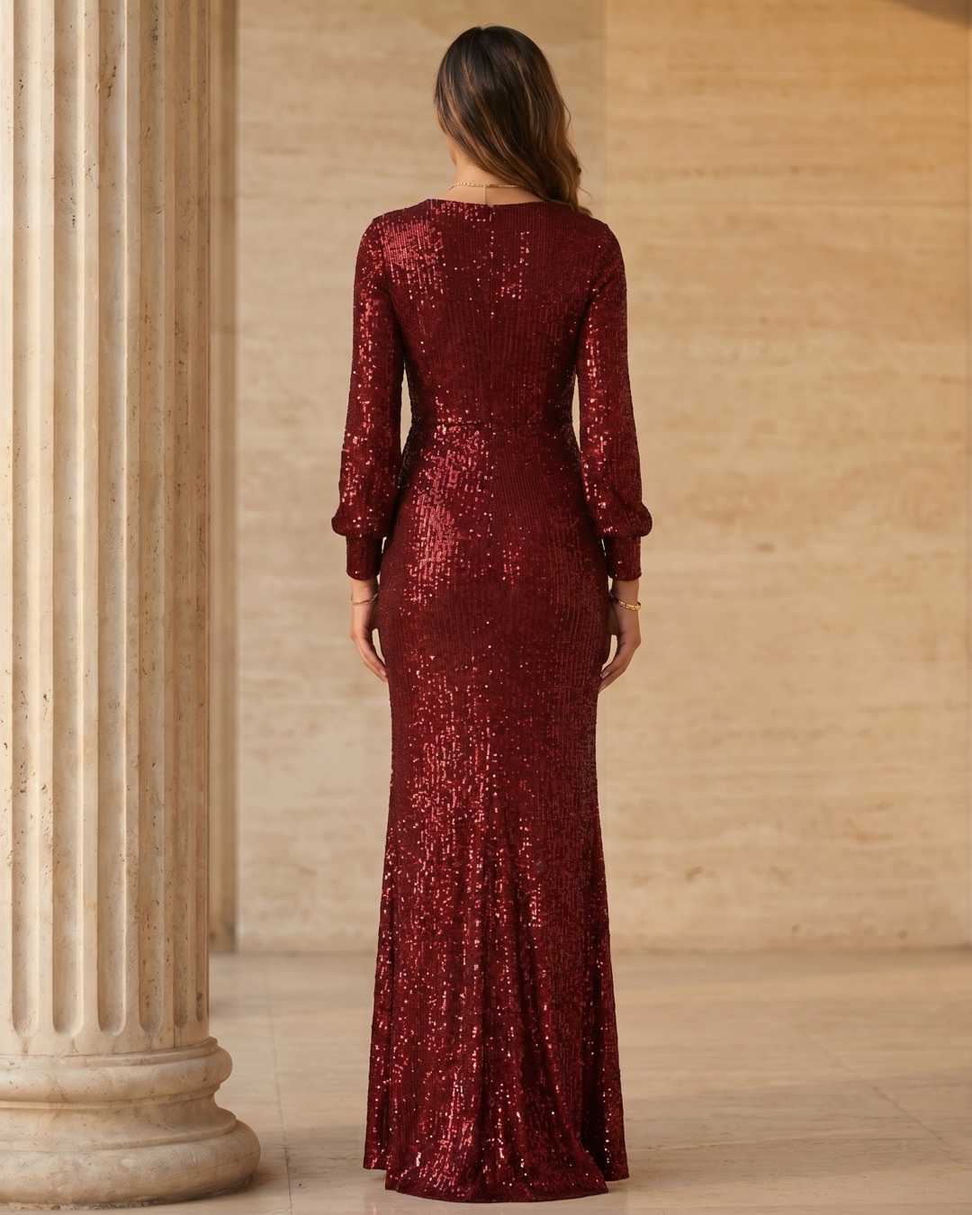 Hugo Caesar Tassi Norbana full-length rear view showing the fitted sequined back bodice, long sleeves and the column skirt falling to the floor