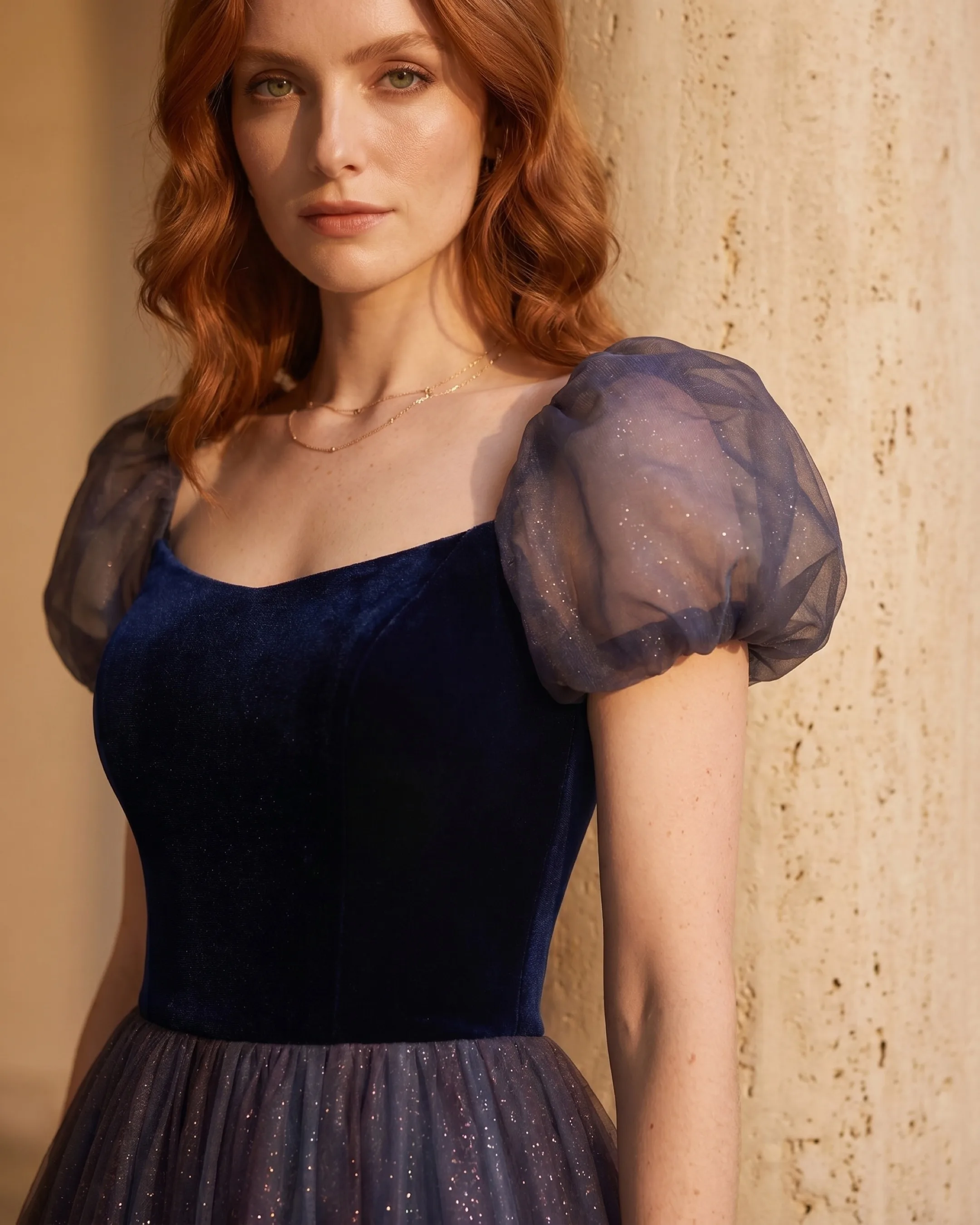 Hugo Caesar Tassi Petronia close-up of the square-neck navy velvet bodice and sheer organza bubble sleeve