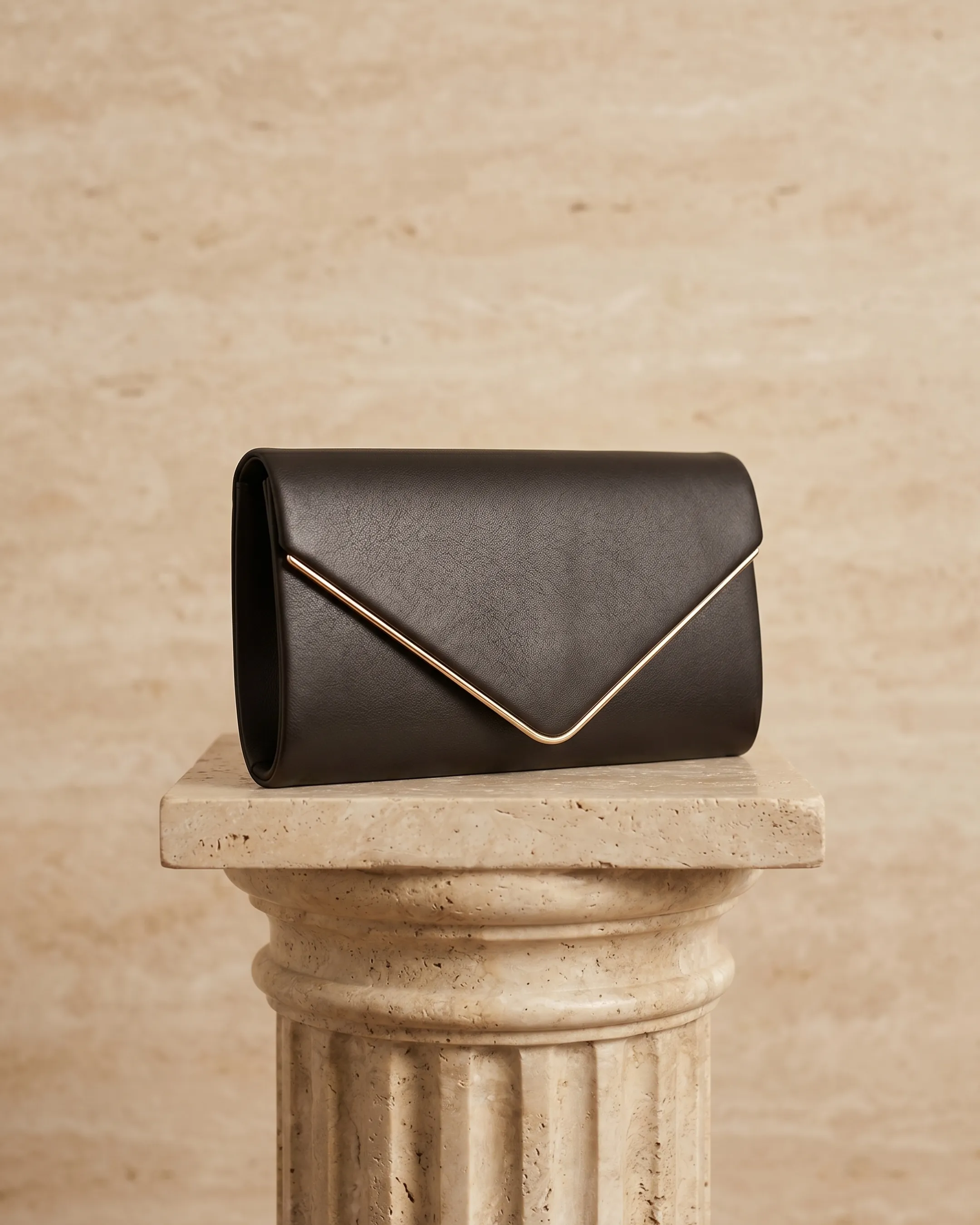 Hugo Caesar Tassi minimalist leather envelope clutch in Basalt — studio packshot, Hugo Caesar Tassi