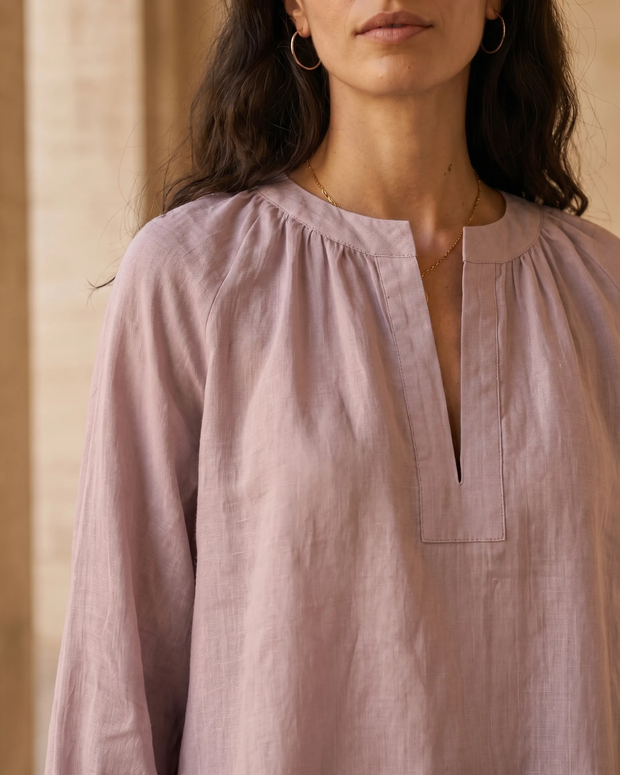 Hugo Caesar Tassi Roscia close-up of the round band neckline, short notched slit placket and soft gathering over airy ramie