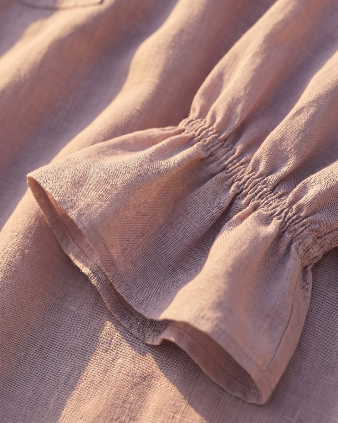 Hugo Caesar Tassi Roscia fabric macro of lightweight smoky-lilac ramie with the ruffled bell-cuff edge
