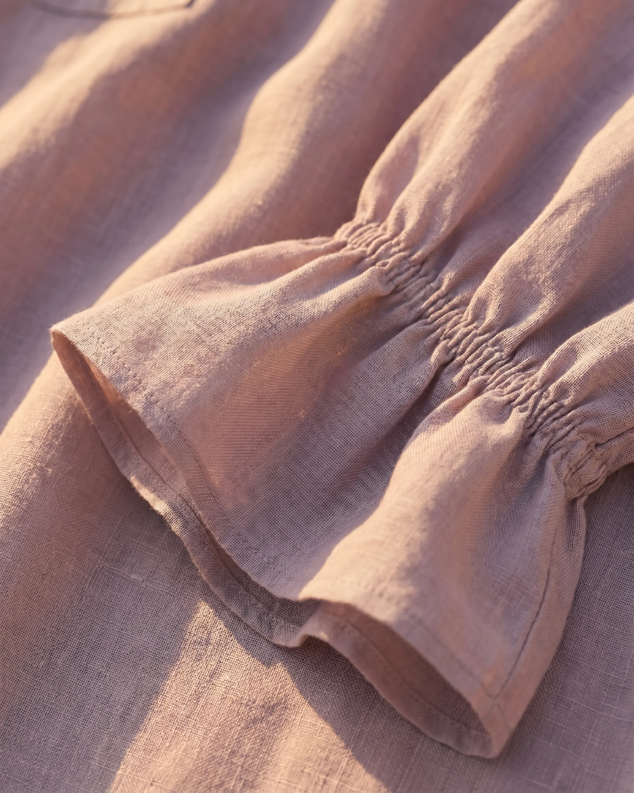 Hugo Caesar Tassi Roscia fabric macro of lightweight smoky-lilac ramie with the ruffled bell-cuff edge