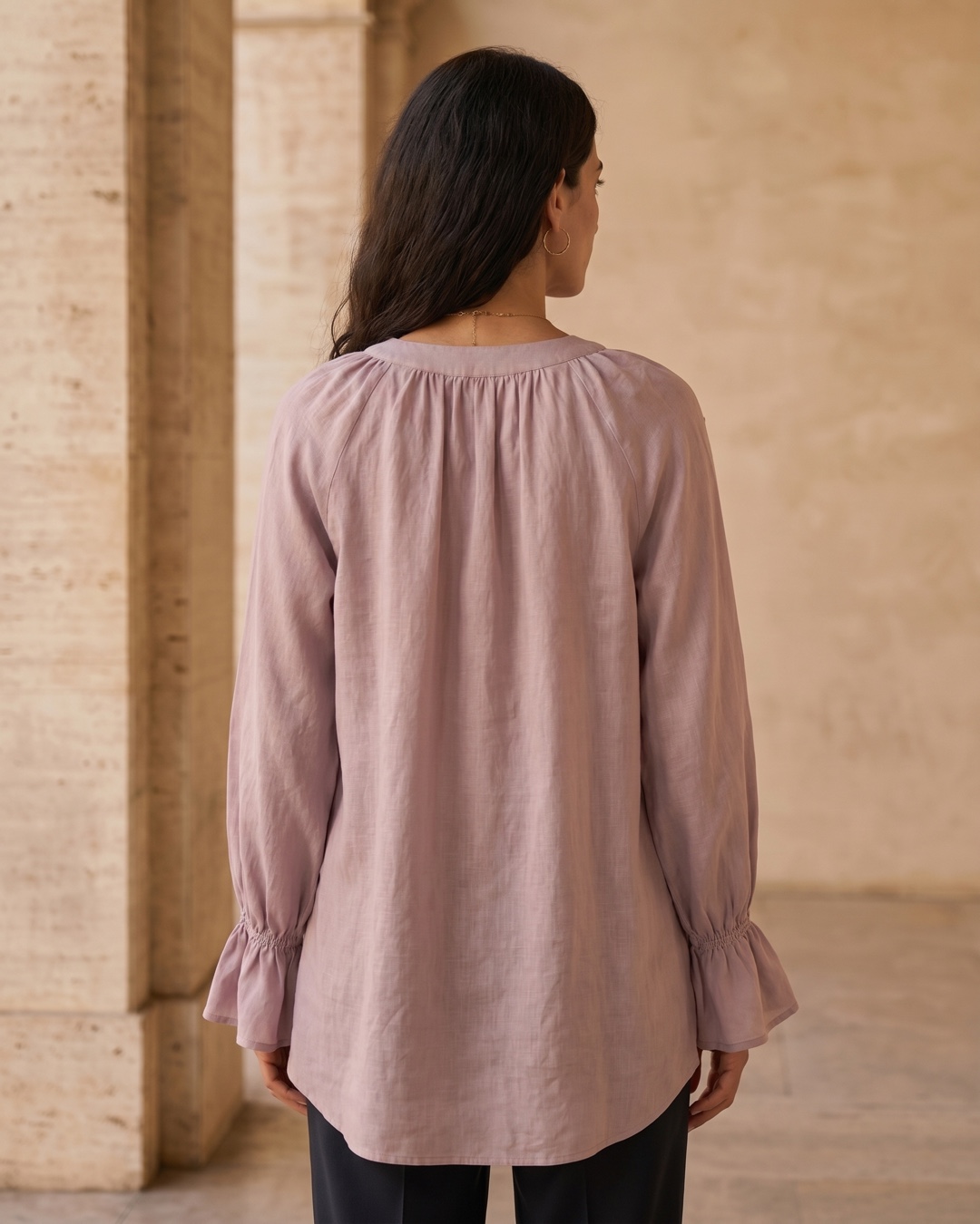 Hugo Caesar Tassi Roscia full-length rear view showing the gathered round back neck, ruffled bell cuffs and dipped high-low back hem in Lavanda