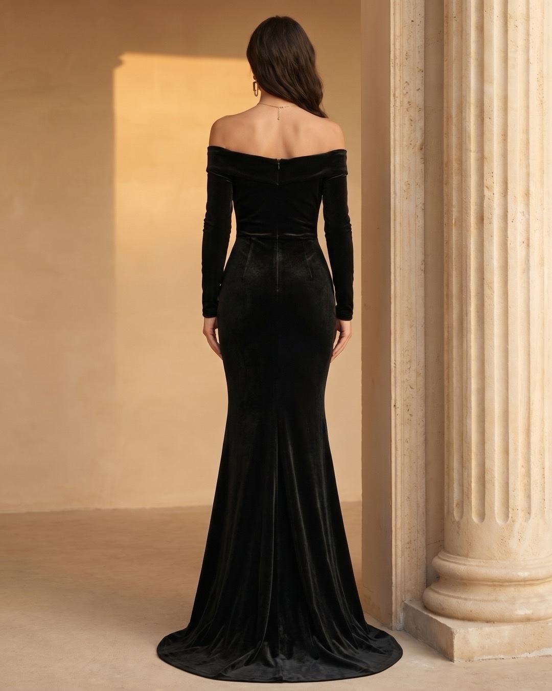 Hugo Caesar Tassi Rufina full-length rear view showing the off-shoulder back band, fitted velvet back bodice, long sleeves and mermaid skirt