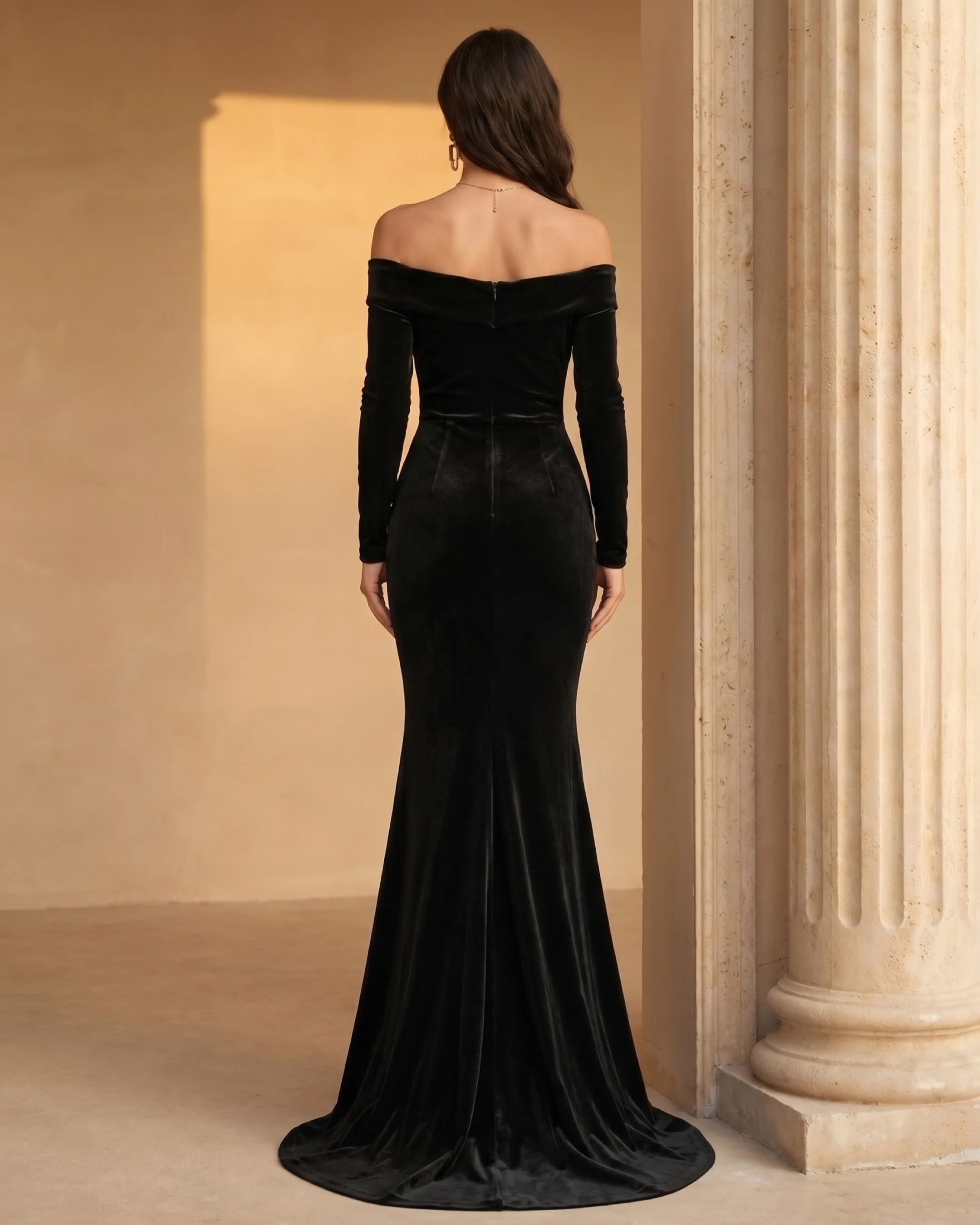 Hugo Caesar Tassi Rufina full-length rear view showing the off-shoulder back band, fitted velvet back bodice, long sleeves and mermaid skirt
