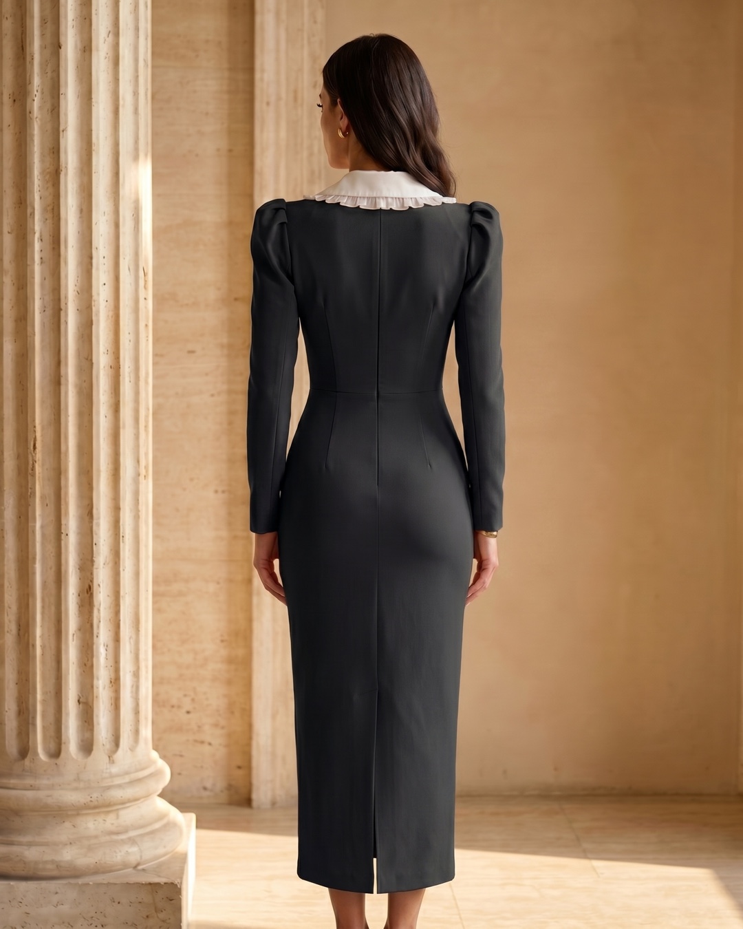 Full-length rear view of the Hugo Caesar Tassi Servilia crepe day dress showing the centre-back seam and hem slit