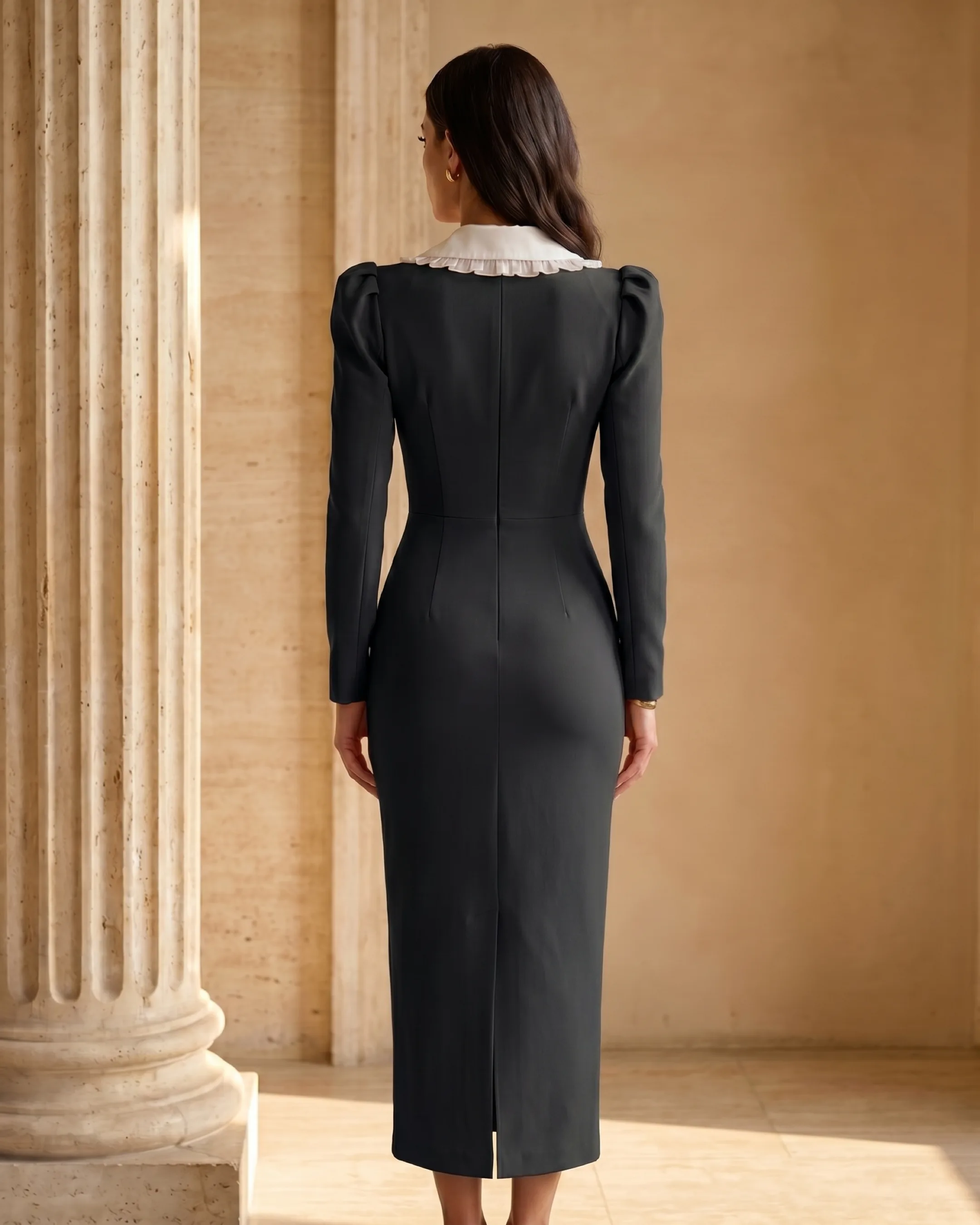 Full-length rear view of the Hugo Caesar Tassi Servilia crepe day dress showing the centre-back seam and hem slit