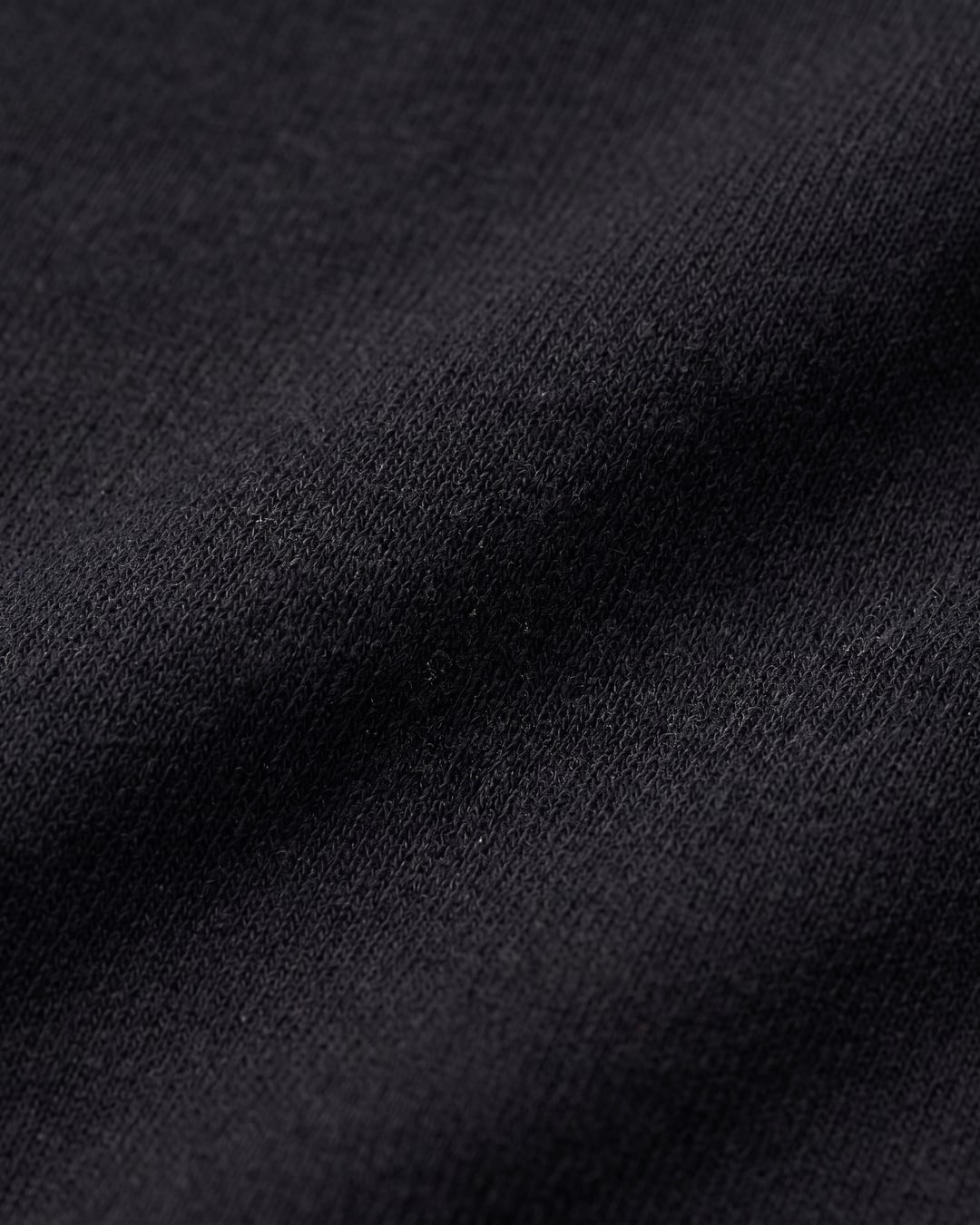 Macro of the Vipsania modal-blend satin jersey — matte sheen and fluid drape