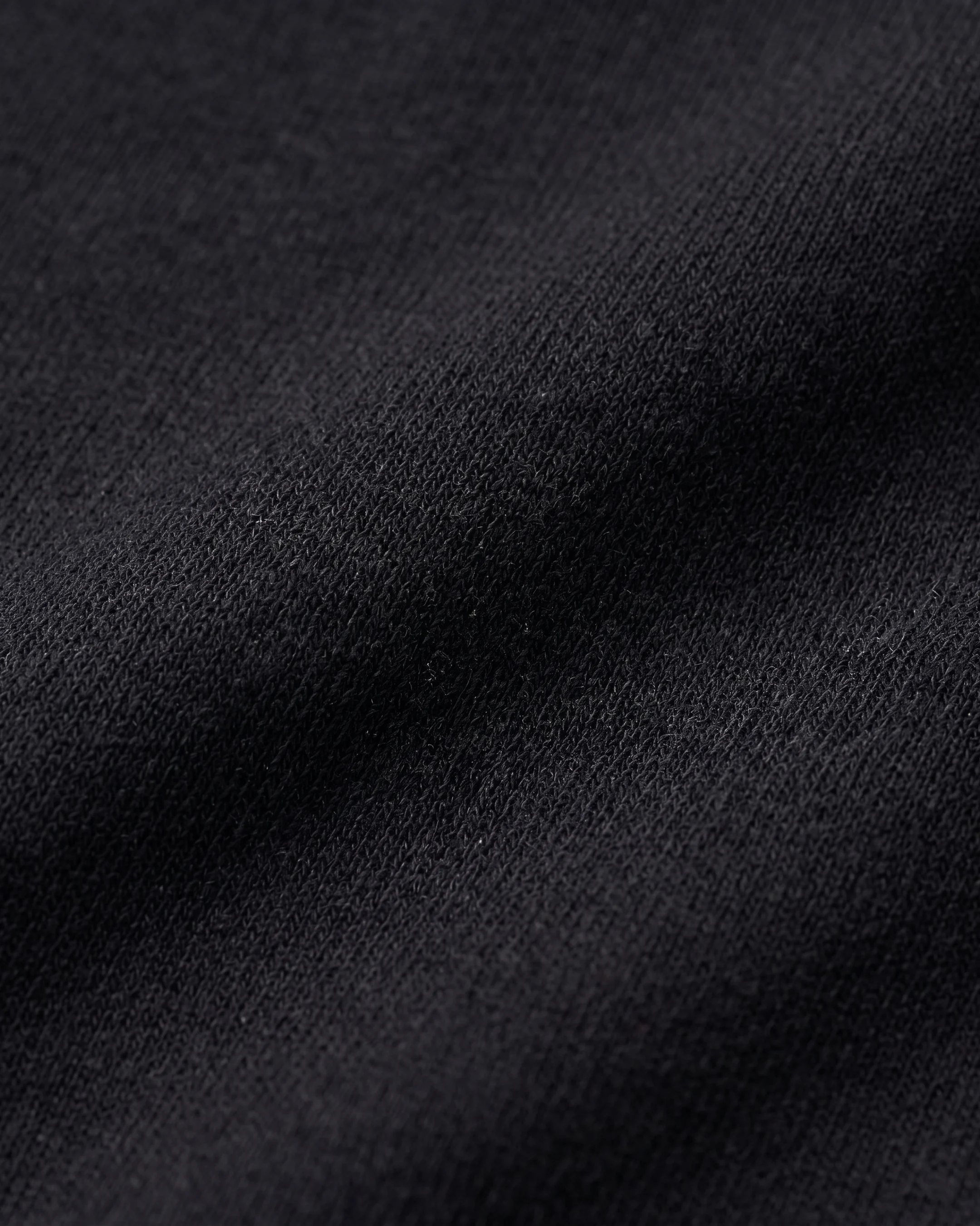Macro of the Vipsania modal-blend satin jersey — matte sheen and fluid drape